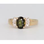 A 9ct yellow gold diamond and gem set ring 3.1 grams, size N 1/2