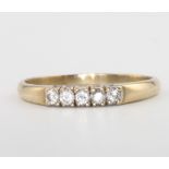 A 9ct yellow gold 5 stone diamond ring, 2 grams, size R