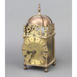 An Elliott lantern clock contained in a gilt metal case with battery operated movement 44cm h x 10cm