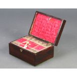 A Victorian rosewood trinket box with hinged lid with brass shell shaped panel to the top, marked