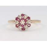 A 9ct yellow gold ruby and diamond cluster ring, 2 grams, size P