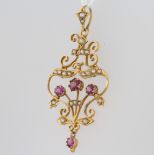 A 9ct yellow gold ruby and pearl pendant, 45mm, 2.5 grams 1 pearl is missing