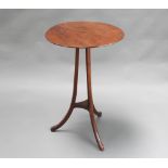 A circular Art Nouveau mahogany snap top table raised on 3 outswept supports with shaped undertier