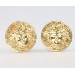 A pair of 18ct yellow gold mask ear clips, 8.6 grams