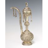 A Persian repousse silver baluster Hookah with scrolling flowers and peacock finial, 438 grams, 28cm