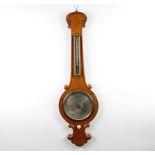 A 19th Century mercury barometer and thermometer with silvered dial, contained in a light oak