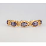 A yellow gold amethyst bracelet, gross 16 grams