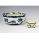 A William Moorcroft Florian Ware shallow bowl decorated with the poppy design and with wavy rim,