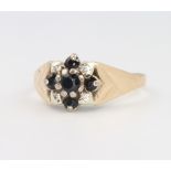 A 9ct yellow gold sapphire and diamond cluster ring, 3.5 grams, size N 1/2