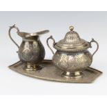 A Persian silver jug, 2 handled sugar bowl and and cover and tray, engraved with flowers and