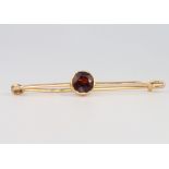 A 9ct yellow gold garnet bar brooch, 3 grams