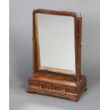 A Queen Anne style arched plate dressing table mirror contained in a mahogany swing frame, the