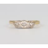 An 18ct yellow gold 3 stone diamond ring 2.5 grams, size M