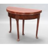 A Georgian mahogany demi-lune triple flap tea/card table, raised on club supports 74cm h x 90cm w