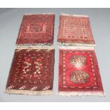 Four Afghan red and black ground slip rugs 68cm x 52cm 1 rug is stained, 2 have moth damage