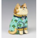 A Rye Pottery Joan and David De Bethel designed cat dated 1991, with glass eyes, wearing a turquoise