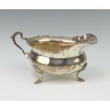 An Edwardian silver sauce boat with S scroll handle on hoof feet Birmingham 1901, 98 grams