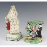 A 19th Century creamware figure of Mary, Christ and 2 attendants, raised on a stepped base with
