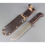 A British Army issue survival knife, blade marked 127/8214 with leather scabbard