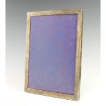 A rectangular Sterling silver photograph frame 32cm x 25cm