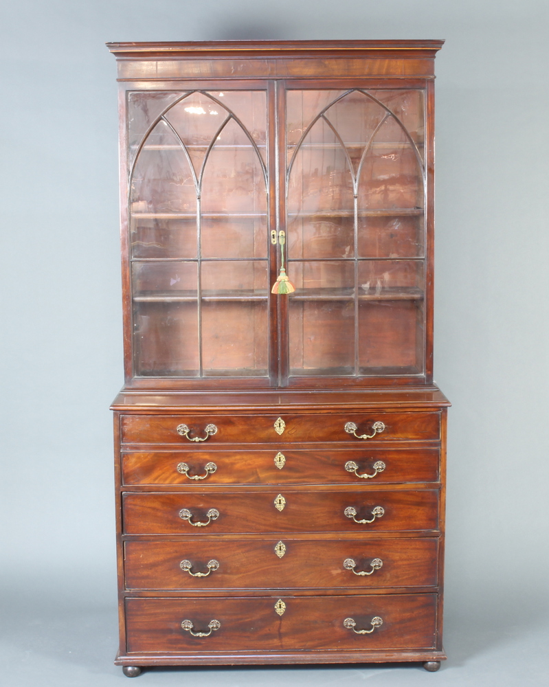 A Georgian mahogany secretaire bookcase, the upper section with moulded cornice fitted adjustable