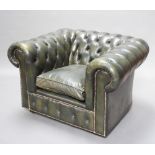 A Chesterfield armchair upholstered in green buttoned leather