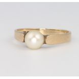 A 9ct yellow gold pearl set ring, size M 1/2, 1.9 grams