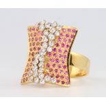 A stylish 18ct yellow gold ruby and diamond dress ring size N, 10.1 grams