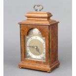 Elliott, a Queen Anne style bracket clock with gilt dial and silvered chapter ring contained in a
