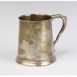 A Georgian style silver christening tankard Birmingham 1931, 127 grams