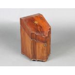 A Georgian inlaid mahogany knife box of serpentine outline, raised on bracket feet 37cm x 23cm x