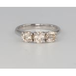 An 18ct white gold 3 stone diamond ring approx. 1.58ct, size M