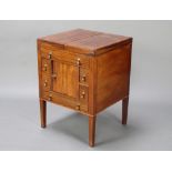 A Georgian mahogany enclosed wash stand with hinged top, the base enclosed by a panelled door