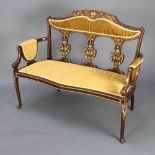 An Edwardian inlaid mahogany two seat sofa with inlaid shaped slat back, upholstered in brown
