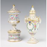 A modern Dresden 2 handled urn and cover raised on a circular base decorated with spring flowers