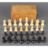A Staunton chess set approx. 5cm h x 2.5cm diam. contained in a pine box There is a very slight chip