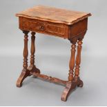 A Victorian quarter veneered walnut work table of serpentine outline, fitted a drawer, raised on 4