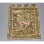 A machine made tapestry panel depicting girl on a swing 90cm x 80cm
