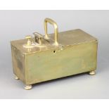 A 19th Century rectangular brass tobacco honour box with hinged lid, raised on on bun feet 12cm x