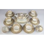 A Wedgwood Gold Florentine W4219 part tea set comprising tea pot, 6 tea cups, 6 saucers, 6 side