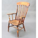 A 19th Century elm and beech stick and rail back kitchen chair with double H framed stretcher,