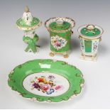 A 19th Century Paris Porcelain pot pourri, the green ground decorated with panels of birds and