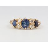 An 18ct yellow gold sapphire and diamond ring, size M, 3.2 grams