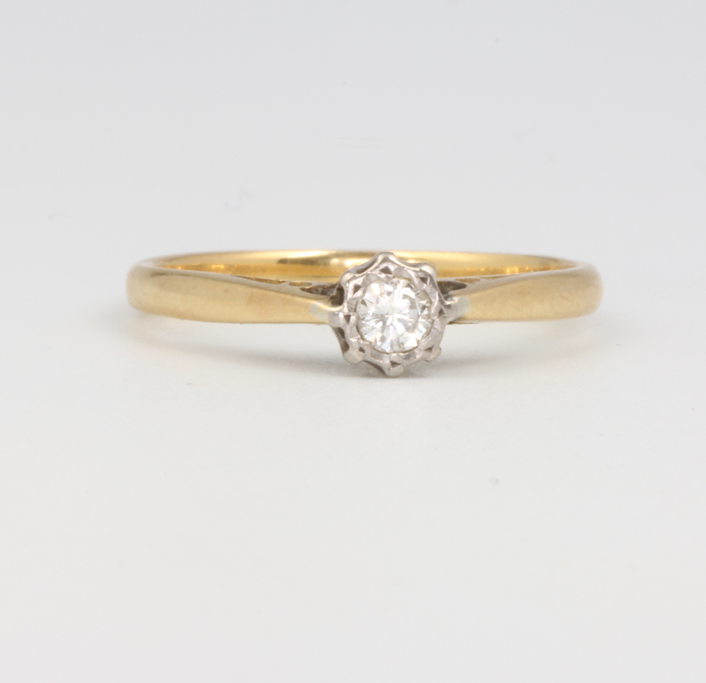 An 18ct yellow gold illusion set diamond ring 0.10ct, size M, 2.7 grams