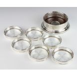 A set of 6 Sterling silver mounted glass based coasters and a Tiffany and Co. silver coaster 13cm