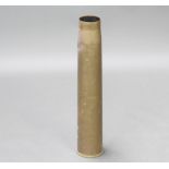 A large brass shell case, base marked 1939, 67cm h x 13cm diam.