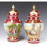 A pair of 20th Century Austrian vases decorated in the style of Kaufman with figures in landscapes