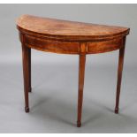A Georgian demi-lune crossbanded mahogany card table, raised on square tapered supports spade feet