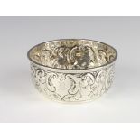 An Edwardian repousse silver bowl decorated with scrolls and monogram Birmingham 1902, 8.5cm, 76