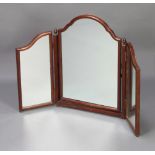 A 1930's arch shaped triple plate dressing table mirror contained in a mahogany swing frame 63cm h x